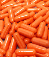 KAHA RHODIOLA ROSEA - MEDICAMENTO HERBOLARIO. Fondo cubierto de cápsulas naranjas.