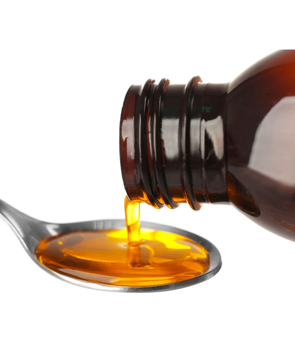 HONI COF-EX - REMEDIO HERBOLARIO. Frasco inclinado sirviendo jarabe brillante color miel en una cuchara. 
